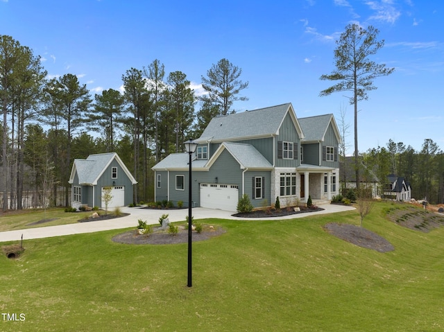 view of front of house with a front lawn and a garage