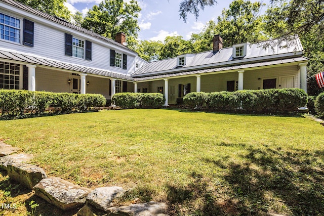 6720 Mebane Oaks Rd, Mebane, NC 27302 - exterior space featuring a chimney, a standing seam roof, a front yard, and metal roof