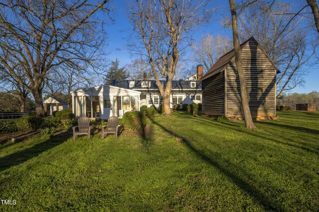 6720 Mebane Oaks Rd, Mebane, NC 27302 - back of property with a lawn and a chimney