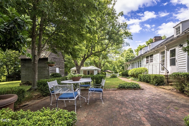 6720 Mebane Oaks Rd, Mebane, NC 27302 - view of patio / terrace with an outdoor structure and outdoor dining space