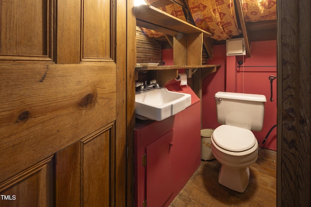 6720 Mebane Oaks Rd, Mebane, NC 27302 - half bathroom with wood finished floors, toilet, and a sink