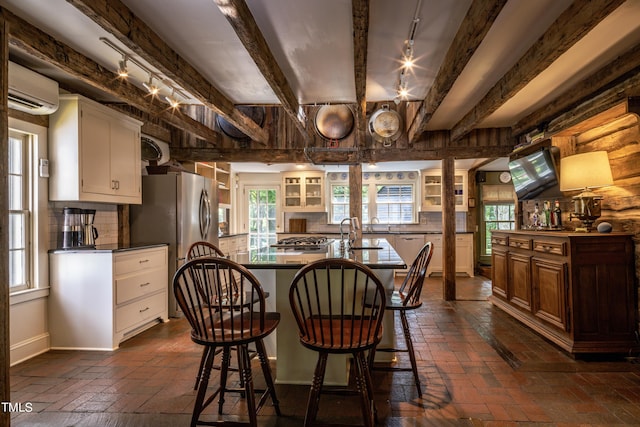 6720 Mebane Oaks Rd, Mebane, NC 27302 - dining area featuring plenty of natural light, an AC wall unit, and brick floor