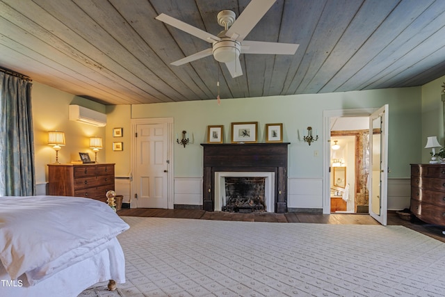 6720 Mebane Oaks Rd, Mebane, NC 27302 - bedroom featuring an AC wall unit, wooden ceiling, wood finished floors, and a fireplace