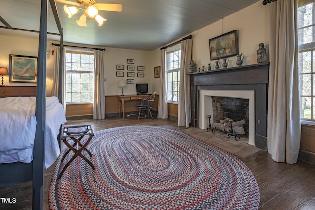 6720 Mebane Oaks Rd, Mebane, NC 27302 - bedroom with hardwood / wood-style floors, a fireplace with flush hearth, and multiple windows