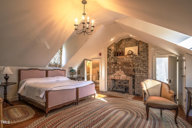 6720 Mebane Oaks Rd, Mebane, NC 27302 - bedroom featuring a notable chandelier, wood finished floors, lofted ceiling, and a fireplace