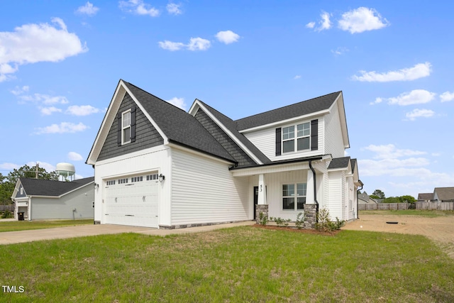 view of front of house featuring a front lawn and a garage