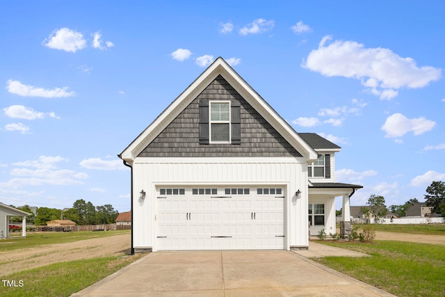 view of front facade with a garage and a front lawn