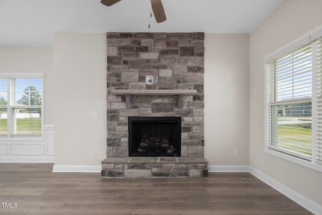 unfurnished living room featuring a healthy amount of sunlight and wood-type flooring