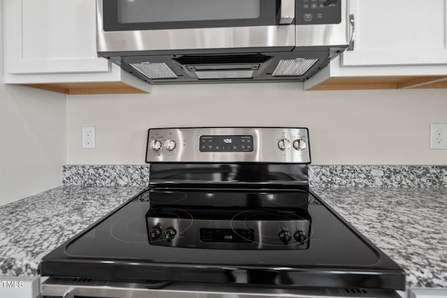 interior details featuring stainless steel electric range oven