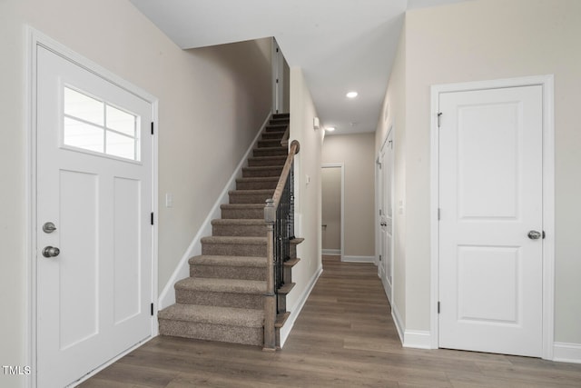 foyer entrance with hardwood / wood-style floors