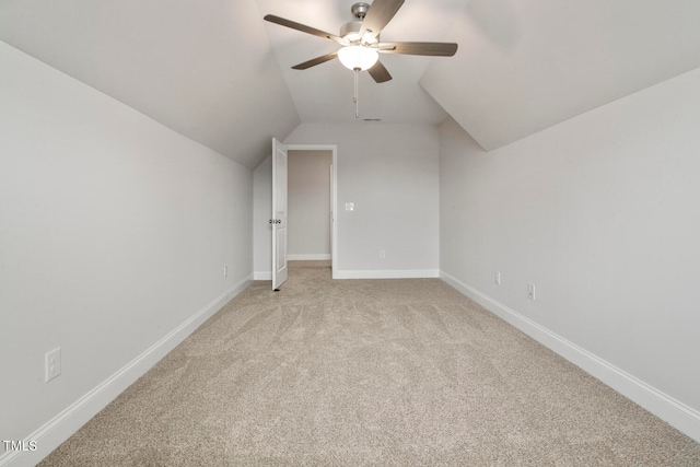 bonus room featuring ceiling fan, vaulted ceiling, and carpet flooring