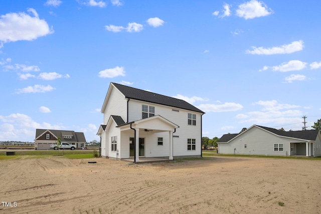 rear view of house featuring a patio area