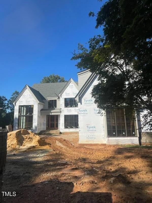 view of property exterior with a sunroom