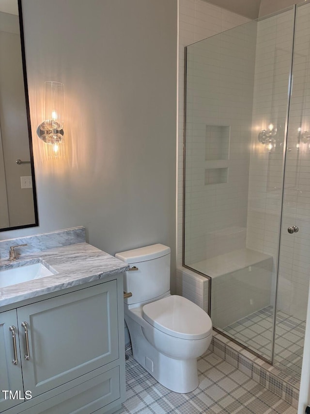 2227 Wheeler Rd, Raleigh, NC 27607 - bathroom featuring vanity, toilet, tile patterned floors, and a shower stall