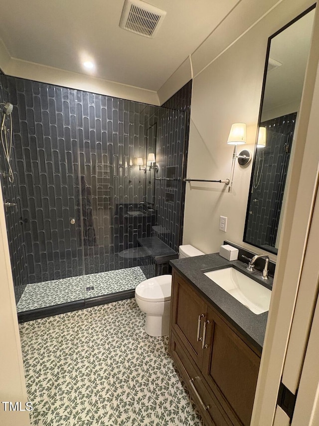 2227 Wheeler Rd, Raleigh, NC 27607 - full bathroom with toilet, vanity, and a tile shower