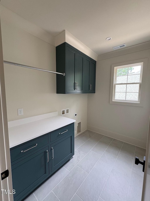 2227 Wheeler Rd, Raleigh, NC 27607 - laundry area featuring hookup for an electric dryer, cabinet space, hookup for a washing machine, baseboards, and light tile patterned flooring