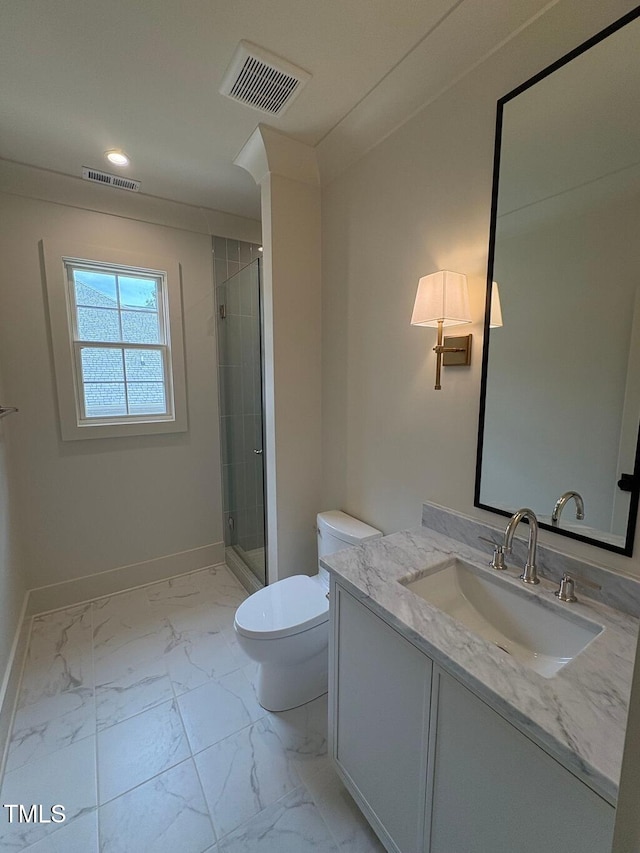 2227 Wheeler Rd, Raleigh, NC 27607 - full bathroom with marble finish flooring, toilet, vanity, baseboards, and a stall shower