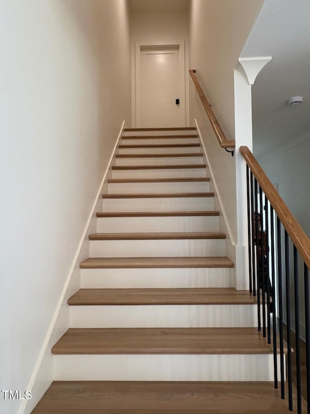 2227 Wheeler Rd, Raleigh, NC 27607 - staircase featuring wood finished floors