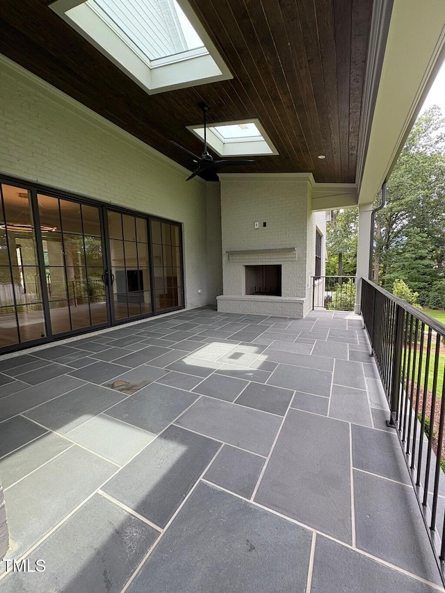 2227 Wheeler Rd, Raleigh, NC 27607 - view of patio with a fireplace and a ceiling fan