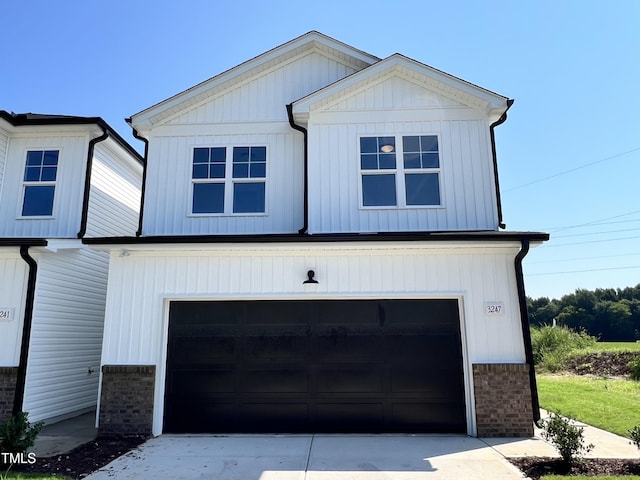 modern inspired farmhouse with a garage