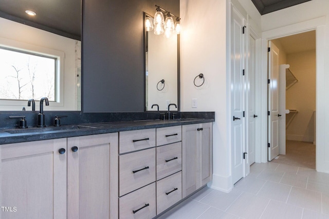 bathroom featuring tile patterned flooring and vanity