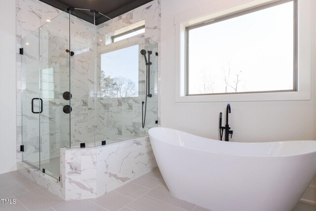 bathroom with plus walk in shower and a wealth of natural light