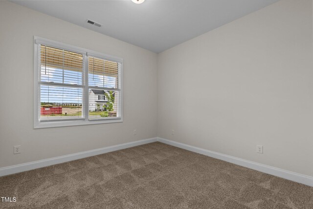 view of carpeted spare room