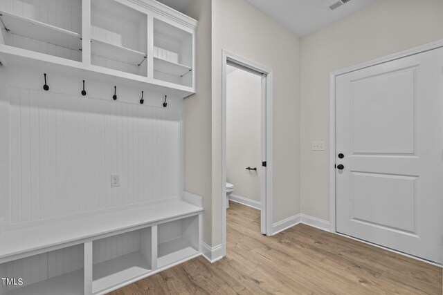 mudroom with light hardwood / wood-style flooring