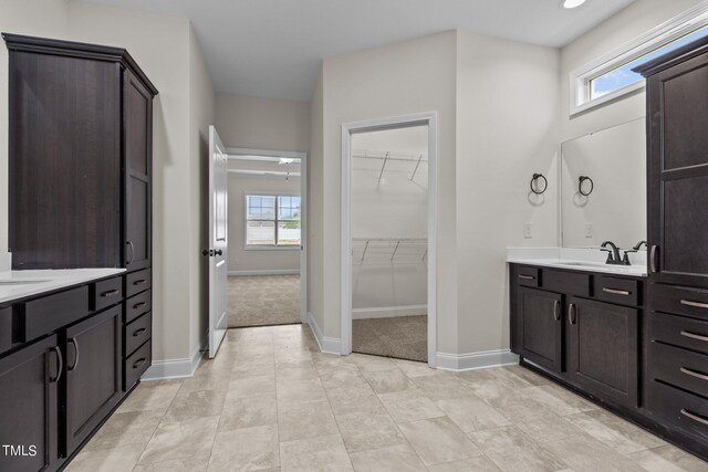 bathroom featuring tile patterned floors and vanity