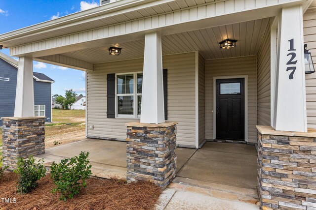 entrance to property with covered porch