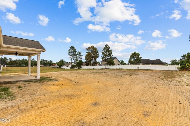 view of yard with ceiling fan