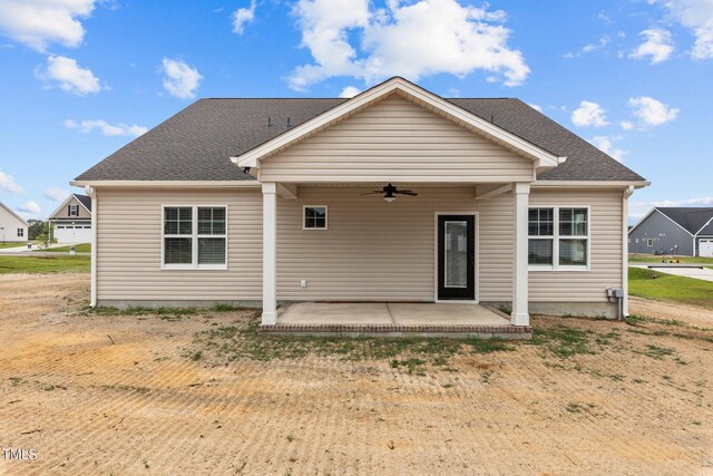 back of property with a patio area and ceiling fan