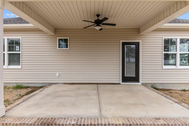 exterior space featuring a patio area and ceiling fan