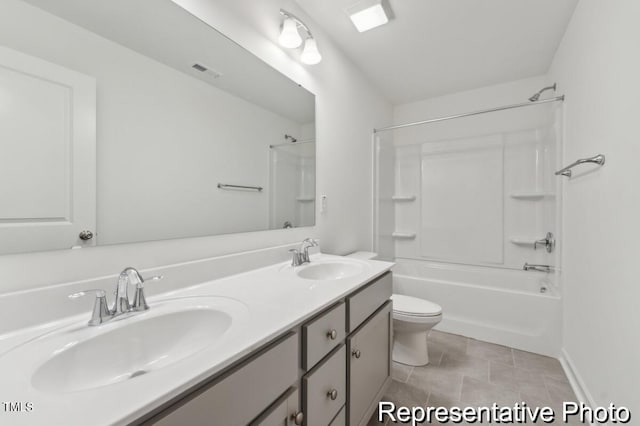 full bathroom with vanity, tile patterned floors, toilet, and shower / bathtub combination