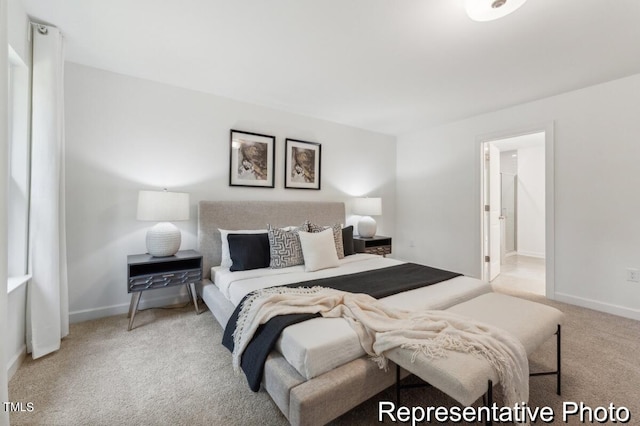 carpeted bedroom featuring connected bathroom