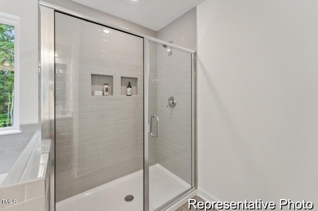 bathroom with an enclosed shower