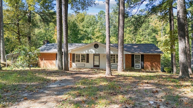 single story home with covered porch