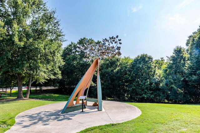 view of play area with a patio area and a lawn