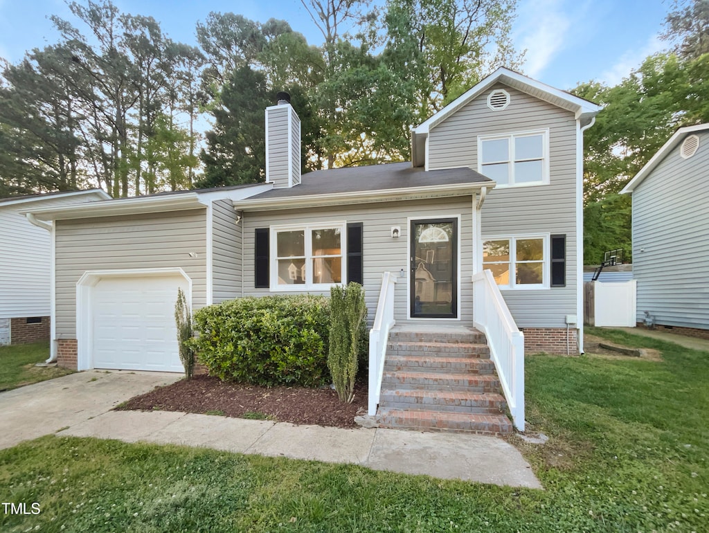 view of front facade with a garage and a front yard