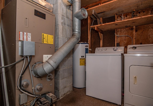 interior space with water heater and washing machine and dryer