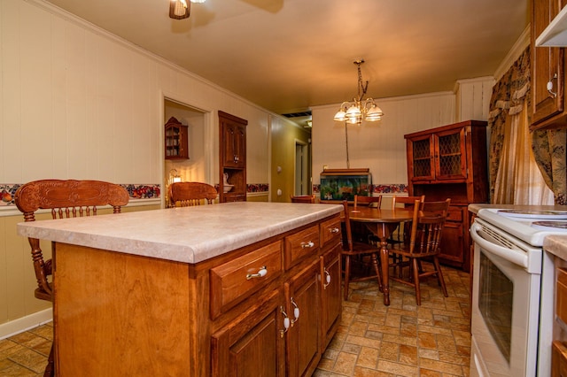 kitchen featuring a center island, pendant lighting, ceiling fan with notable chandelier, light tile floors, and white range with electric stovetop