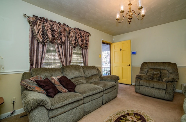 carpeted living room featuring a chandelier