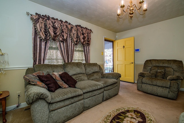 carpeted living room featuring a notable chandelier and a healthy amount of sunlight