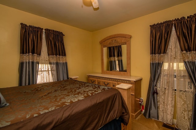 carpeted bedroom featuring ceiling fan