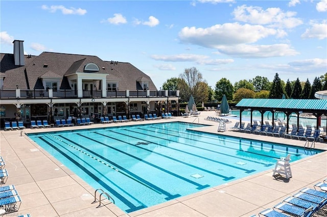 view of swimming pool featuring a patio area