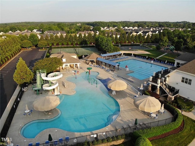 view of pool with a patio area and a water slide