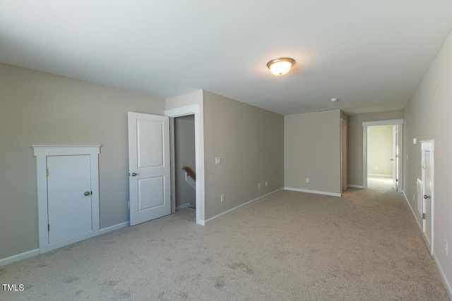 unfurnished room with light carpet