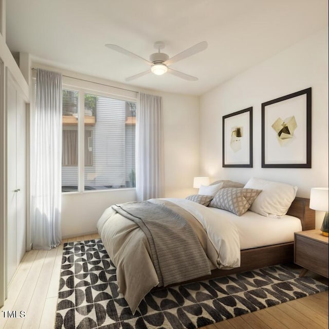 bedroom featuring light wood-type flooring and ceiling fan