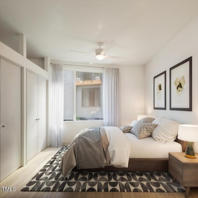 bedroom featuring ceiling fan and light hardwood / wood-style flooring