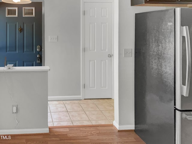 interior space featuring light hardwood / wood-style floors and stainless steel fridge